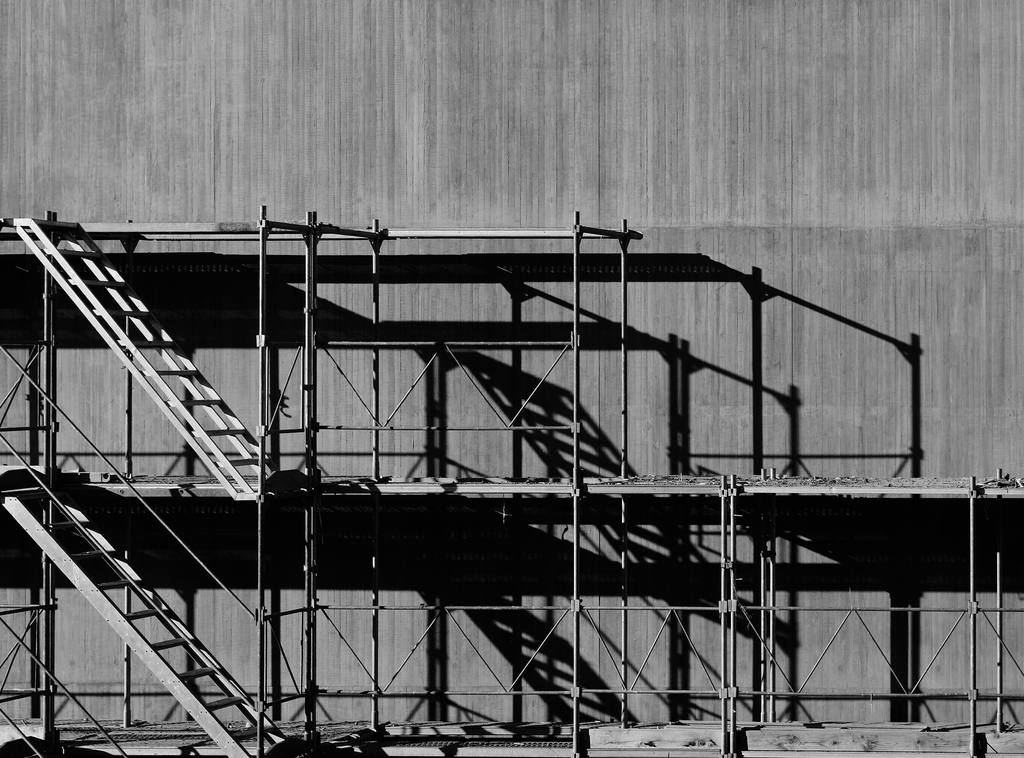 Close detail of scaffold couplers and tubes used in access planning.
