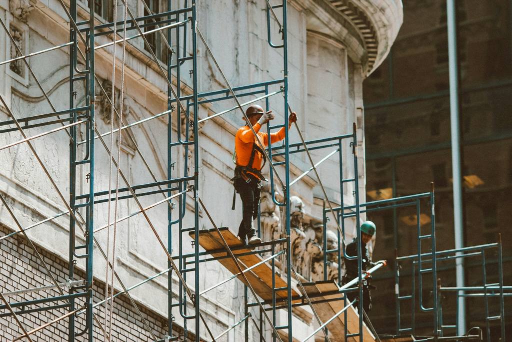 Scaffold platform and boards providing a working surface for contractors.