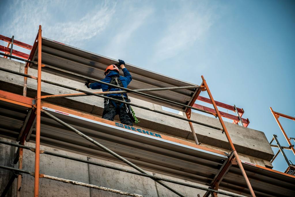 Scaffold guard rails and toe boards illustrating on-site safety checks.
